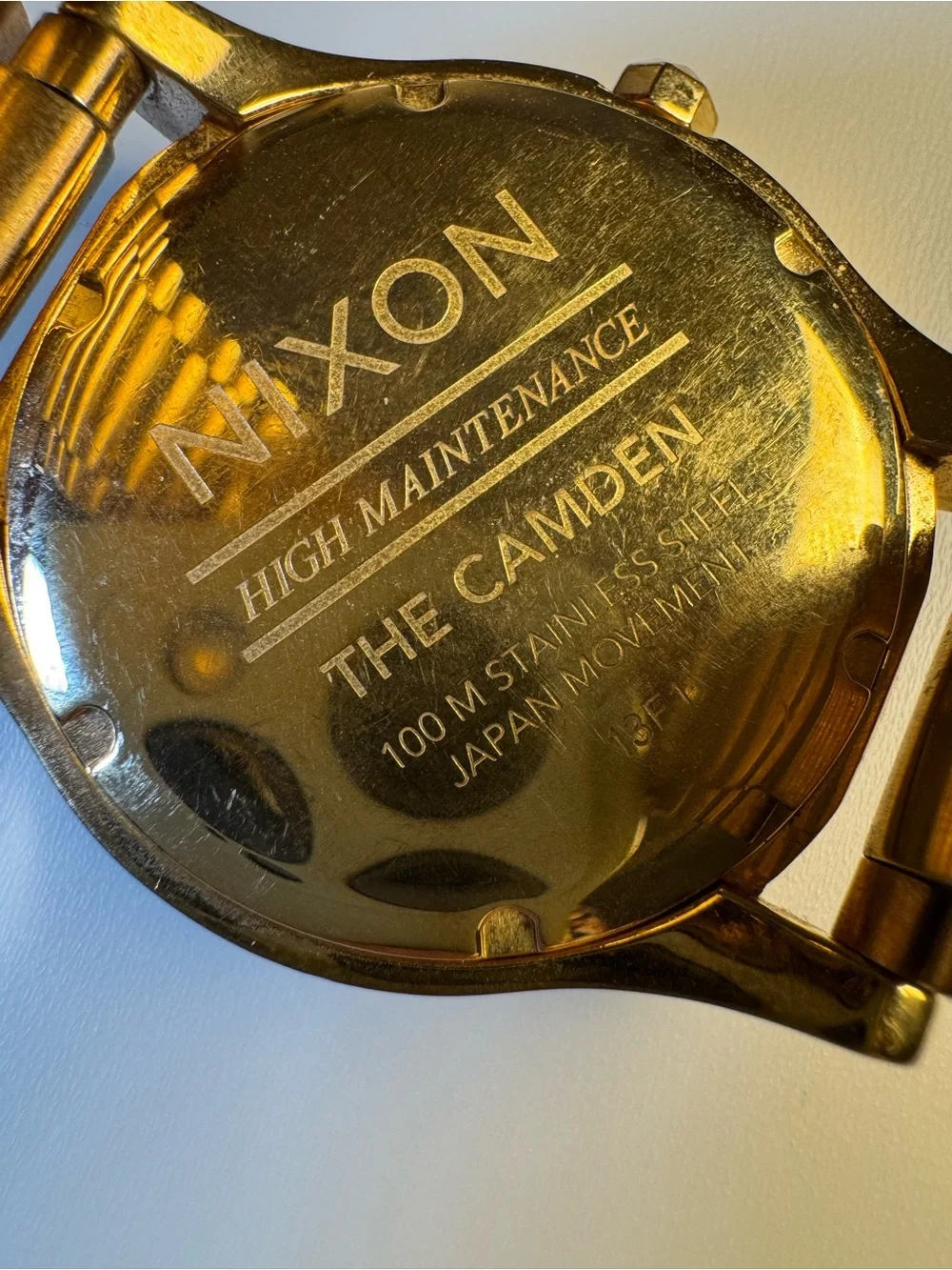 Nixon “High Maintenance” The Camden gold-tone watch w/ real diamond marker.